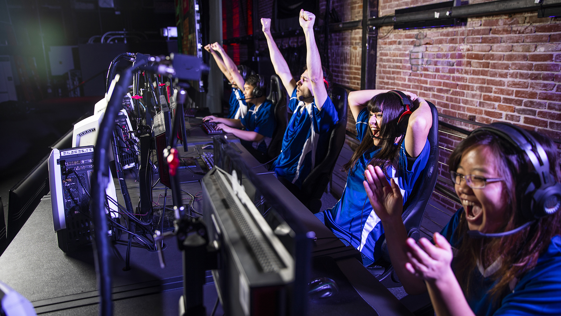 Young professional esports players playing games