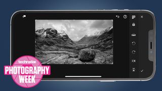 An iPhone shooting a landscape photo in black and white