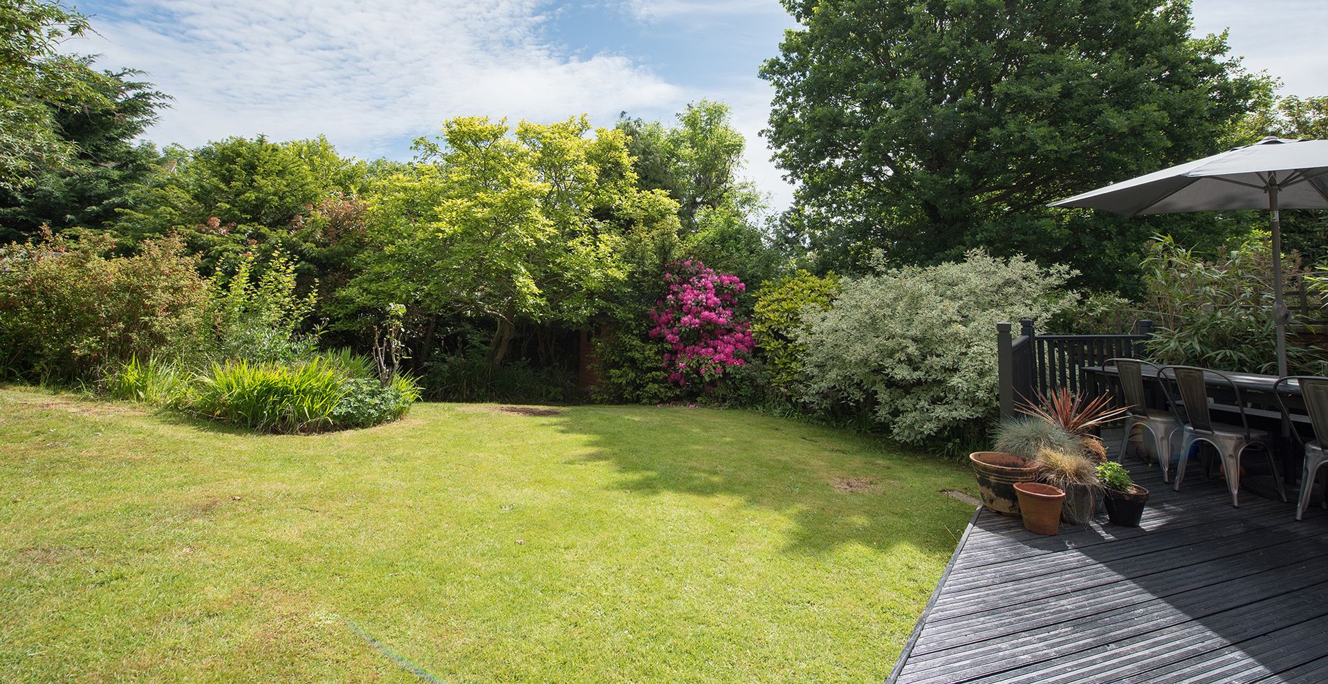 garden with healthy lawn to support a guide on how often to aerate a lawn for good grass