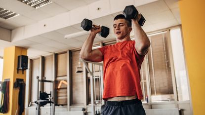 Man exercising with dumbbell