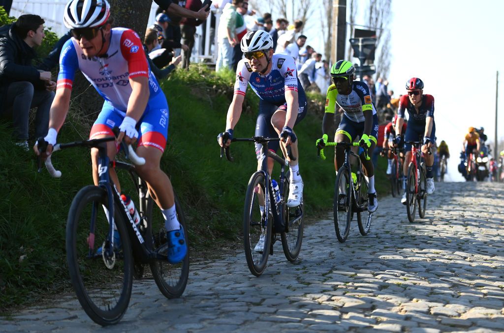 HARELBEKE BELGIUM MARCH 25 Kasper Asgreen of Denmark and Team QuickStep Alpha Vinyl competes in the breakaway through Kwaremont cobblestones sector during the 65th E3 Saxo Bank Classic 2022 a 2039km one day race from Harelbeke to Harelbeke E3SaxobankClassic WorldTour on March 25 2022 in Harelbeke Belgium Photo by Tim de WaeleGetty Images