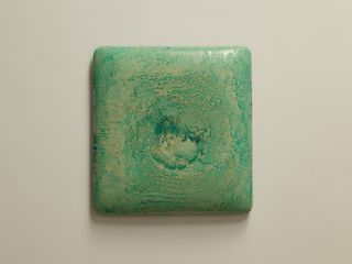 Green textured stone with cream colored background
