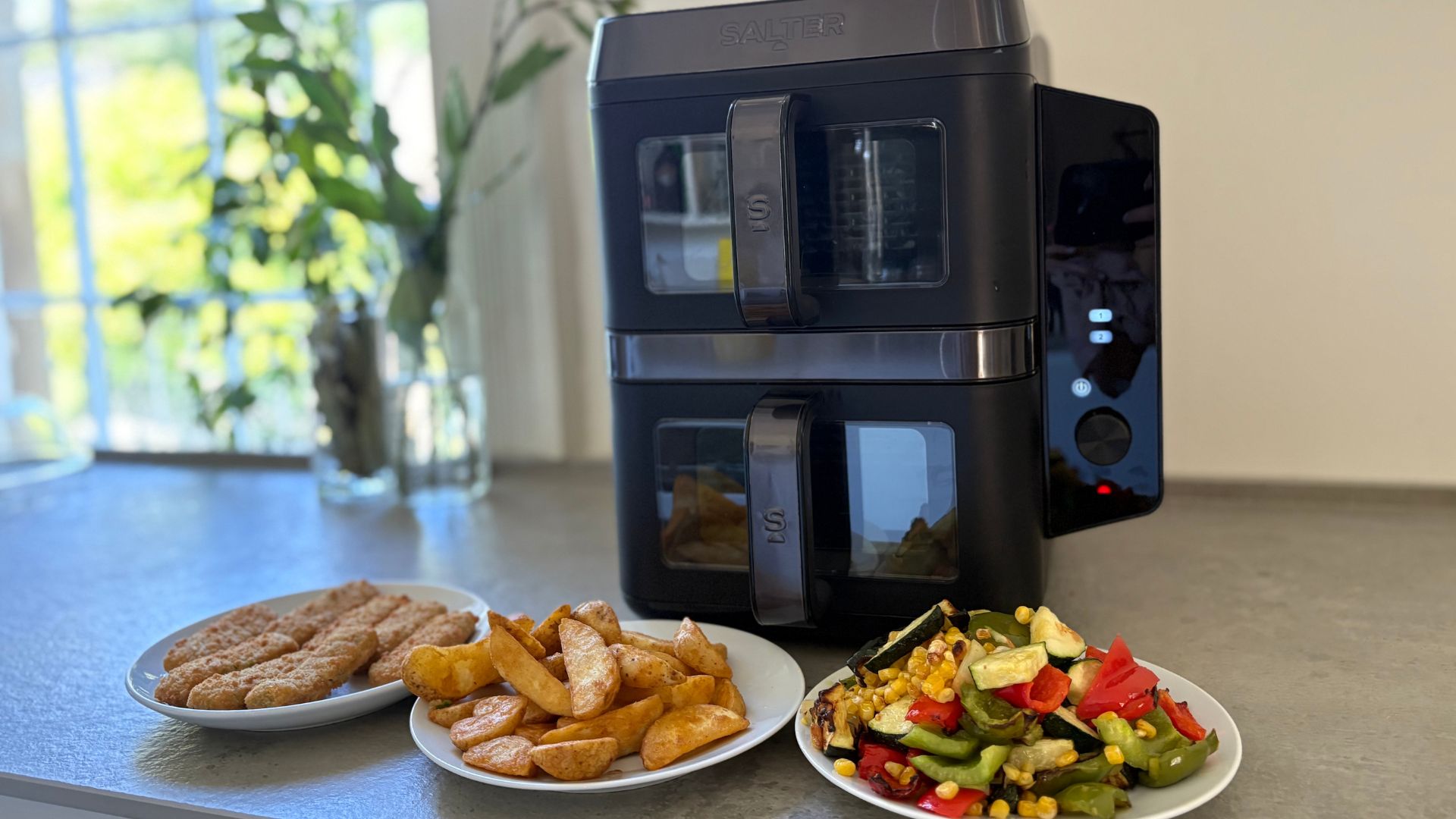 Three plates of food cooked in the Salter VertiCook Air Fryer