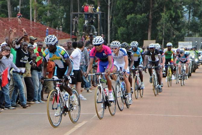 Cyclists pass crowds of spectators in Huye during the fifth edition of the Tour of Rwanda