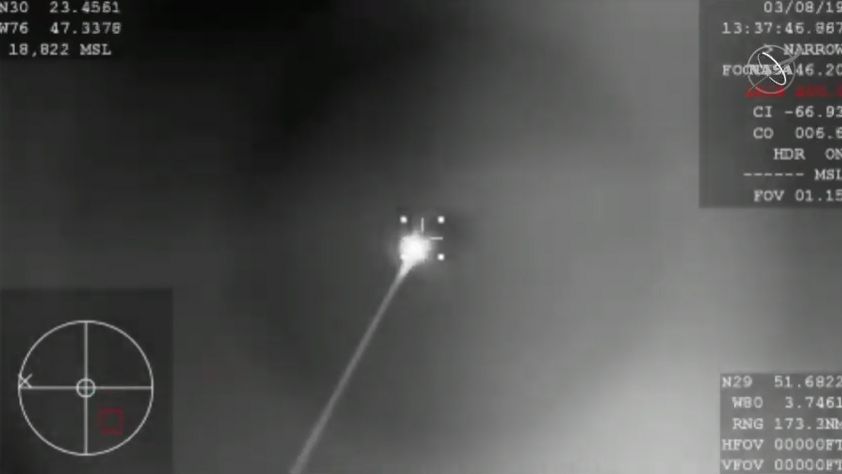 SpaceX's first Crew Dragon spacecraft re-enters Earth's atmosphere in this still from a NASA video captured by a WB-57 reconnaissance plane taken before splashdown in the Atlantic Ocean on March 8, 2019.