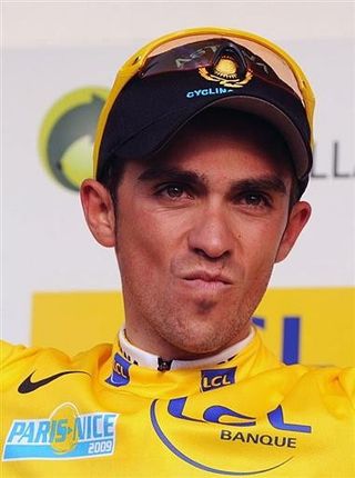 Alberto Contador (Astana) held onto yellow after getting caught behind a crash in the finale.