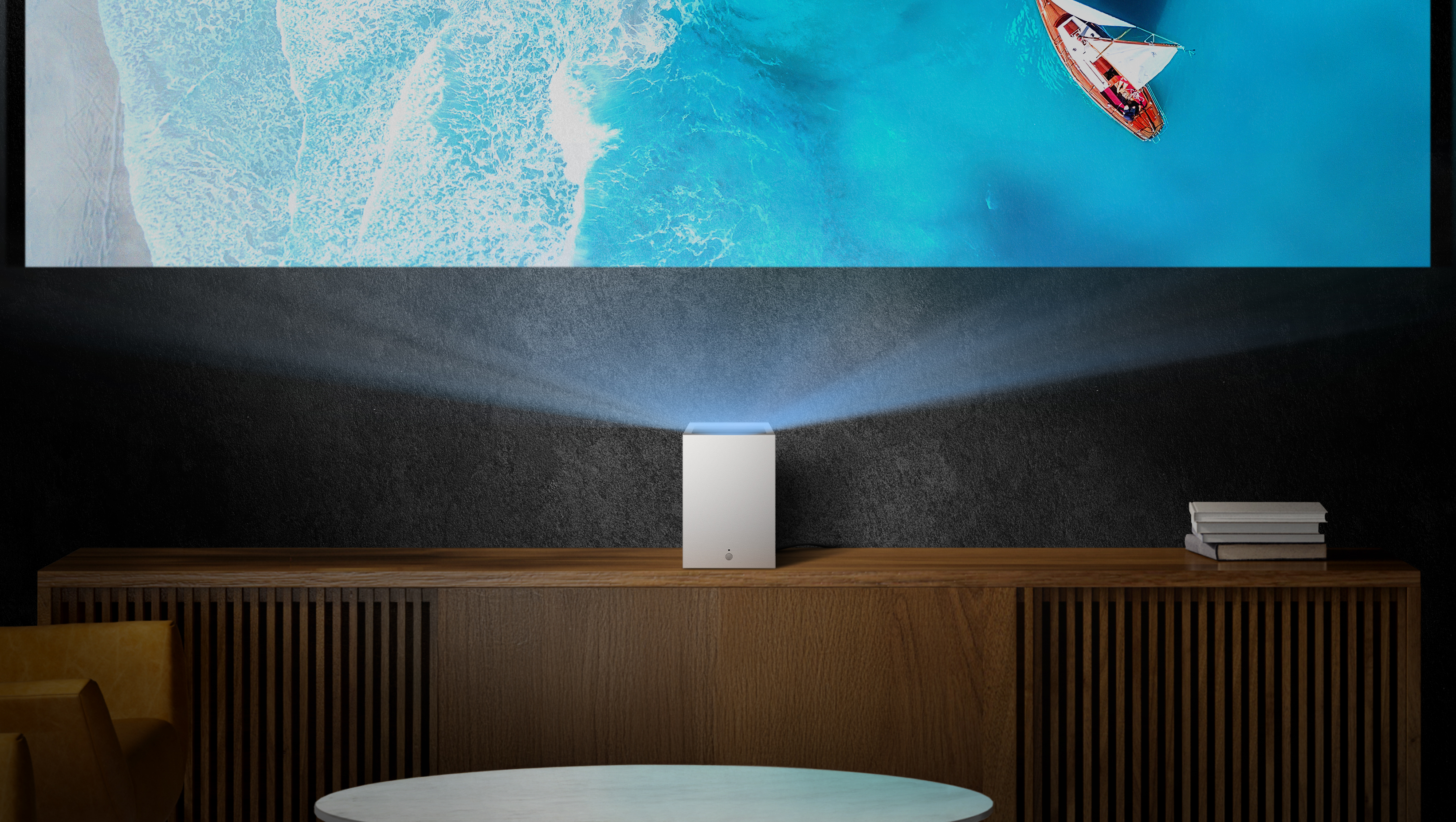 LG CineBeam S lifestyle image with CineBeam S projecting ocean image onto wall