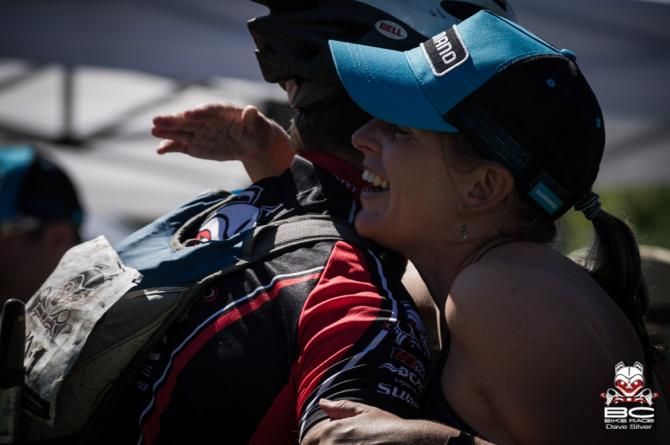 Danielle Baker of racer relations hugging it out at an emotional finish line in Whistler.