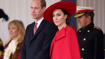 Catherine Princess of Wales wearing red cape dress