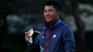 C.T. Pan with the bronze medal at the 2020 Olympics in Tokyo