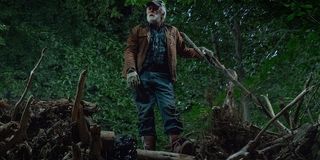 Pet Sematary Jud standing on the deadfall