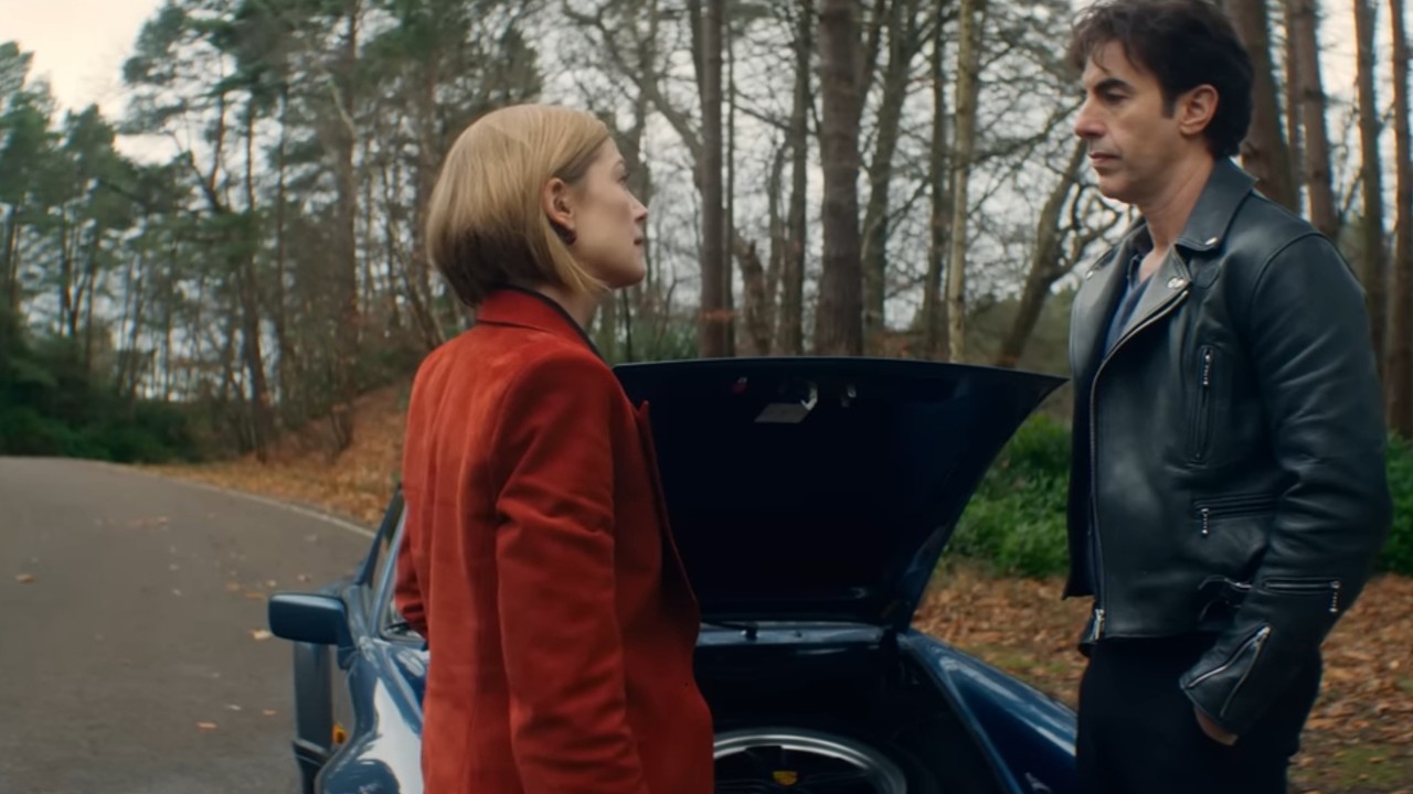 Sacha Baron Cohen and Rosamund Pike chatting in Ladies First.
