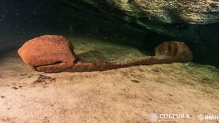 A wooden canoe found inside a cave. 