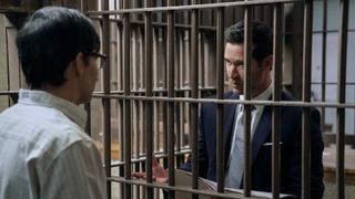 David Rogers and Manuel Garcia-Rulfo as Russell and Mickey standing in prison in The Lincoln Lawyer season 2 episode 1