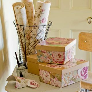 wallpaper in wire basket and floral gift boxes