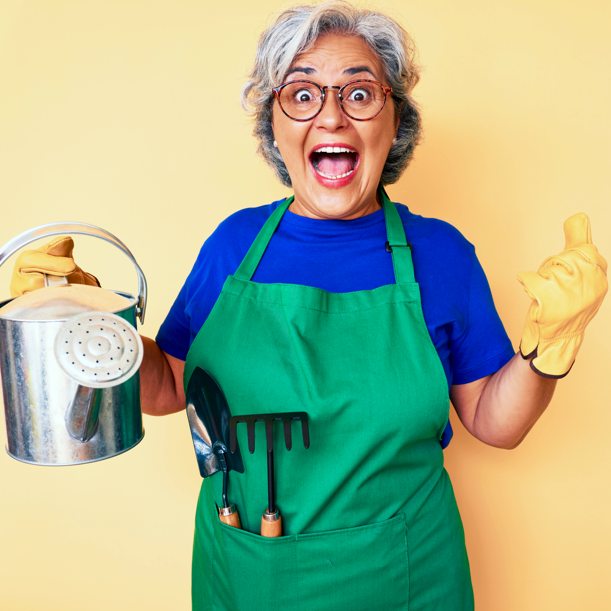 excited gardener with watering can and gardening tools