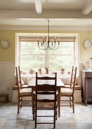 Queen Anne Revival style sash window New England farmhouse with multi-paned top sash