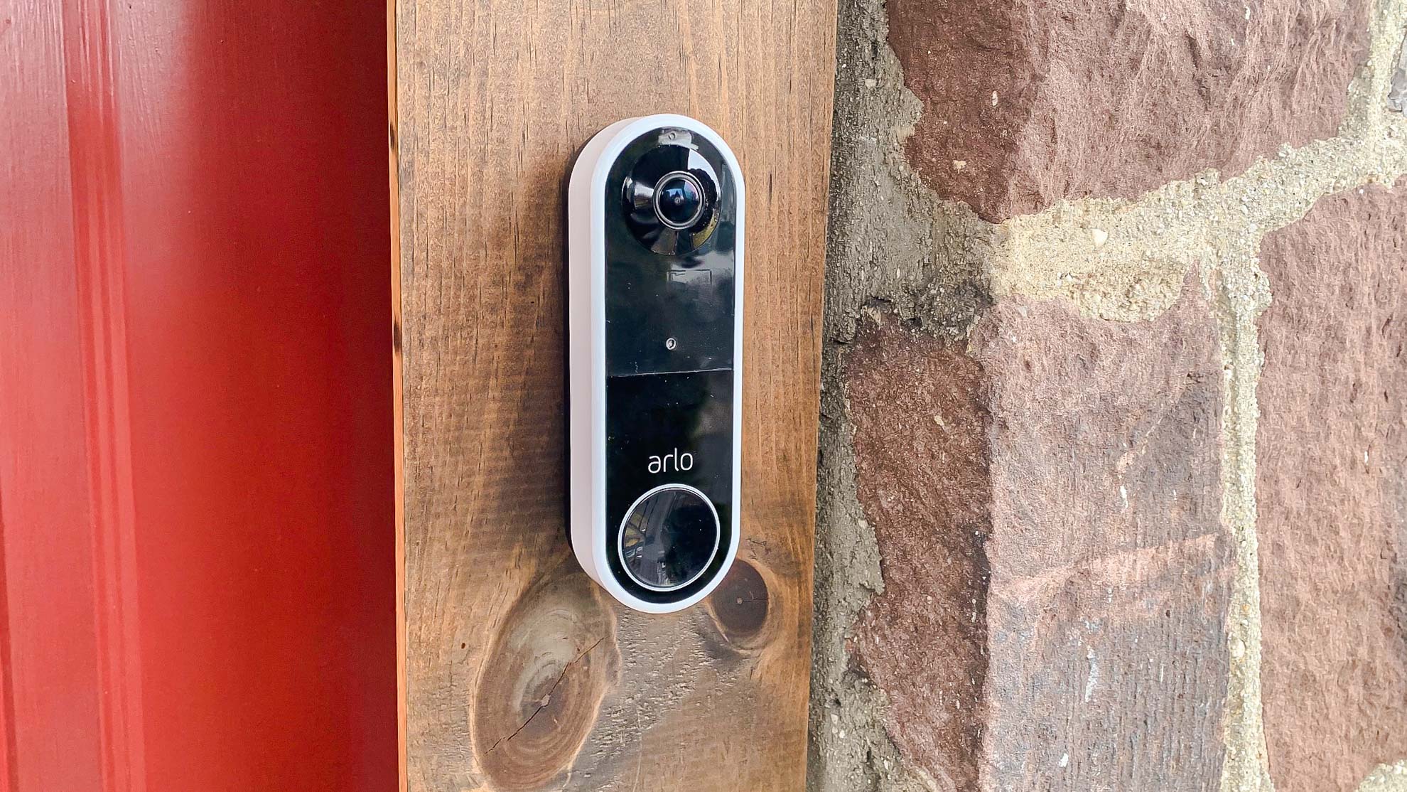 Arlo Essential Wireless Video Doorbell on door frame