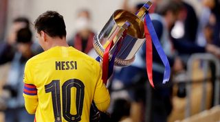 Barcelona captain Lionel Messi lifts the Copa del Rey after victory in the 2021 final over Athletic Club.