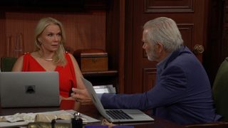 Brooke (Katherine Kelly Lang) in a red dress talking to Eric (John McCook) in The Bold and the Beautiful.