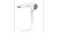 white and pink Cloud Nine The Airshot Pro hair dryer, one of w&h's picks for the best hair dryers for fine hair