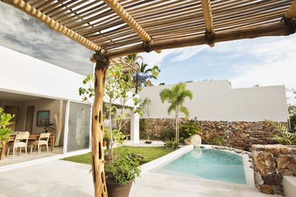 Swimming pool and canopy in backyard