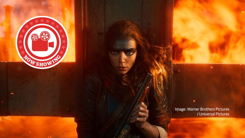 A still from Furiosa: A Mad Max Saga. With the lead character on a burning vehicle.