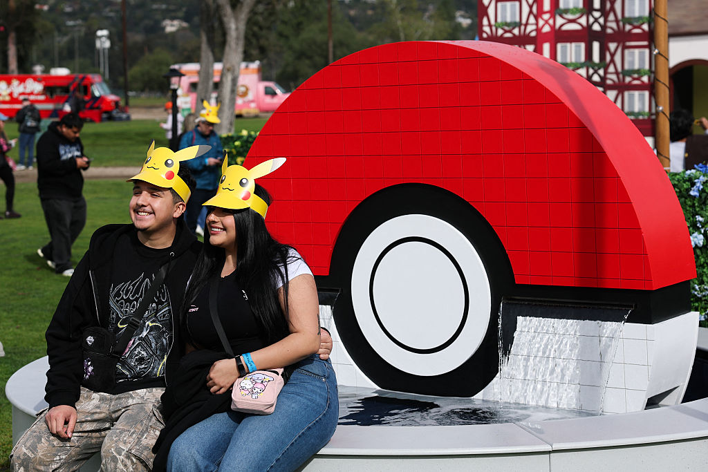 People take pictures by a Poke Ball during the in-person Pokemon GO Tour: Kalos Los Angeles 2026 event