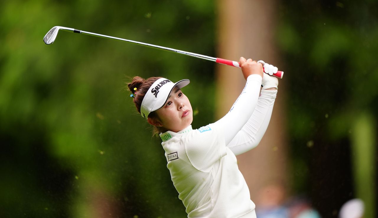 Miyu Yamashita hits a wedge shot and watches its flight