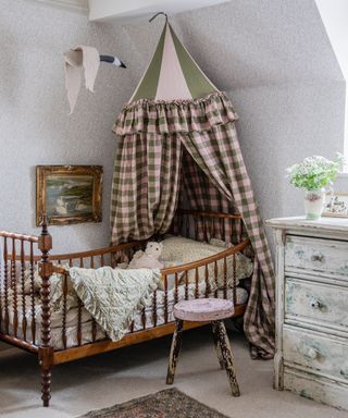 vintage style childrens bedroom with a fun circus style bed canopy