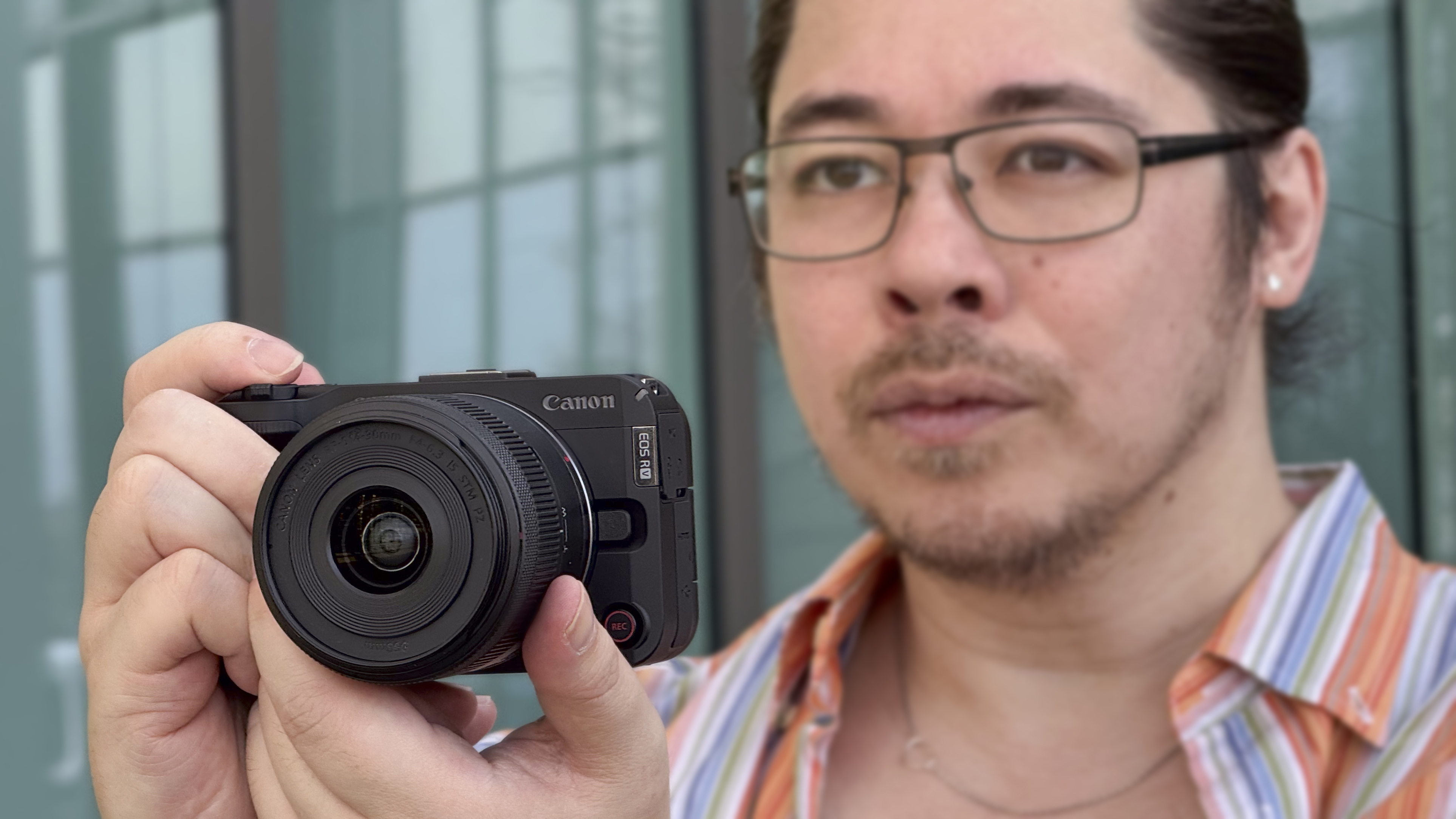 James Artaius holding a Canon EOS R50 V with 14-30mm f/4-6.4 IS STM PZ