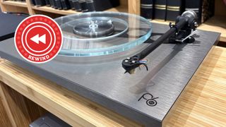 Rega turntable on desk with Rewind logo