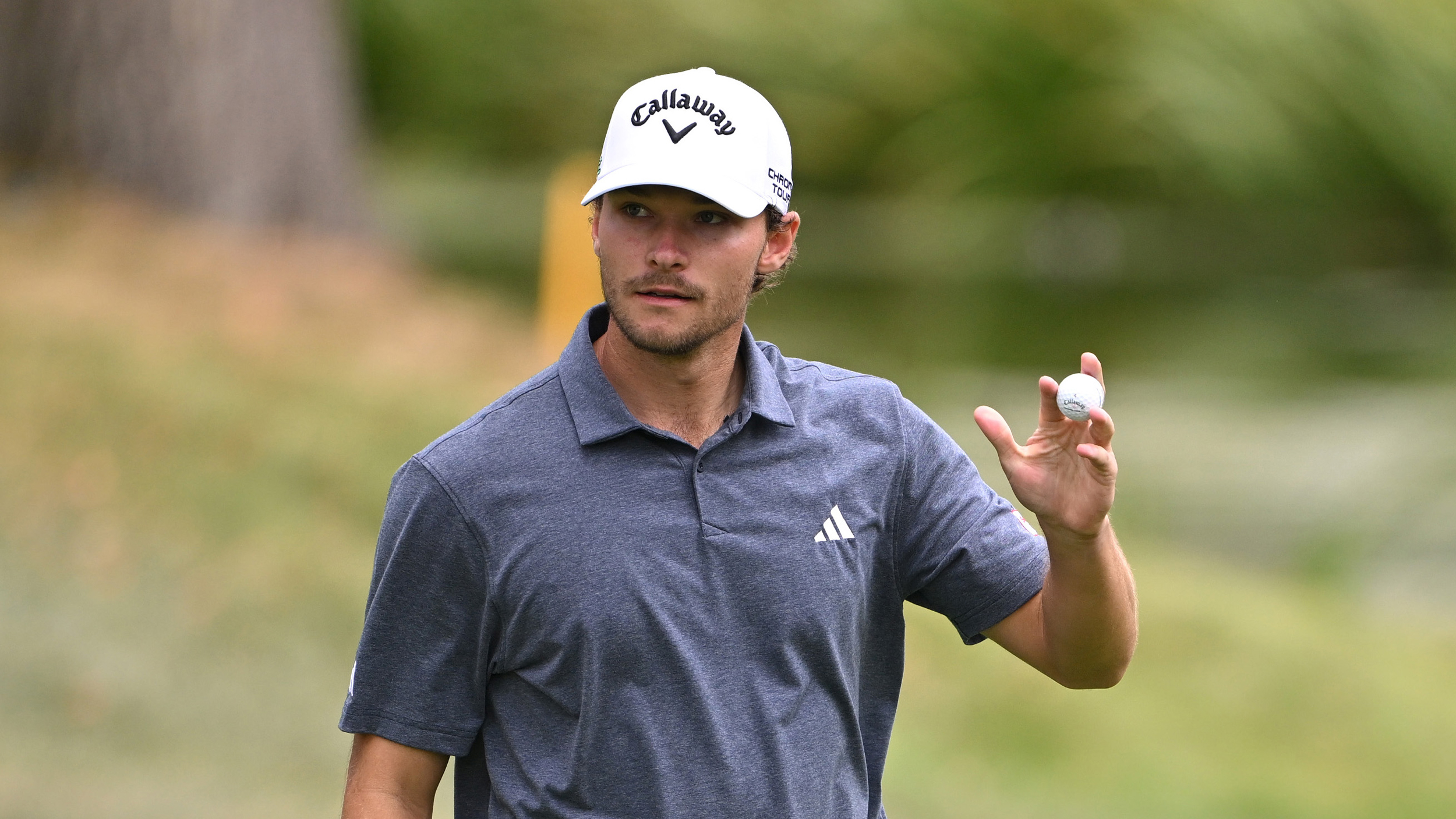 Nicolai Hojgaard waves to the crowd during round four of the 2025 British Masters