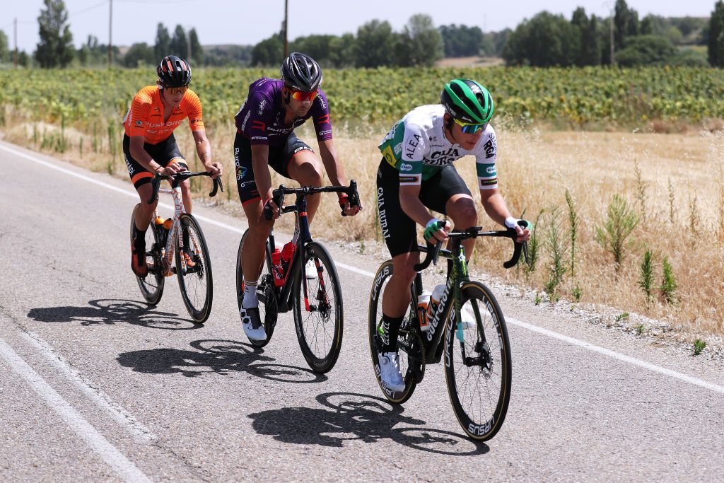 BURGOS SPAIN AUGUST 15 LR Xavier Mikel Azparren Irurzun of Spain and Team Euskaltel Euskadi Diego Rubio Hernandez of Spain and Team Burgos BH and Sergio Roman Martin Galan of Spain and Team Caja RuralSeguros RGA in the Breakaway during the 76th Tour of Spain 2021 Stage 2 a 1667km stage from Caleruega Monasterio de Santo Domingo de Guzmn to Burgos Gamonal lavuelta LaVuelta21 CapitalMundialdelCiclismo on August 15 2021 in Burgos Spain Photo by Gonzalo Arroyo MorenoGetty Images