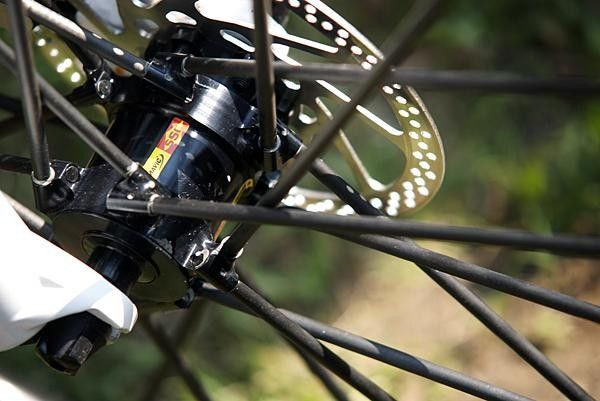 We're not entirely sure if the goop visible around the spoke ends is glue or grease; we're guessing the latter as it'd otherwise be impossible to true the wheel at all after building.
