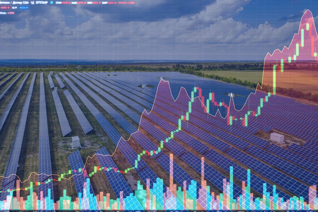 Energy infrastructure investment trusts displayed with aerial view of the solar power station on the background of stock charts