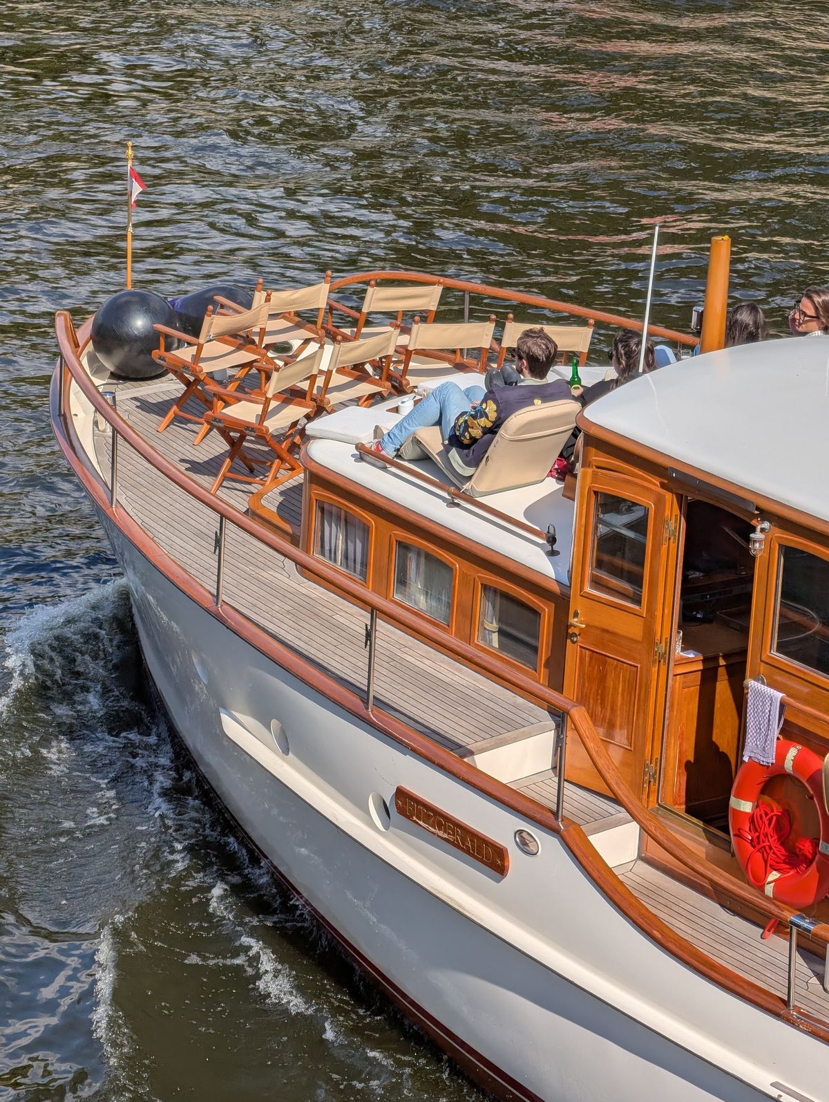People on a boat going down a river