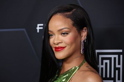 Rihanna poses for a picture as she celebrates her beauty brands fenty beauty and fenty skin at Goya Studios on February 11, 2022 in Los Angeles, California