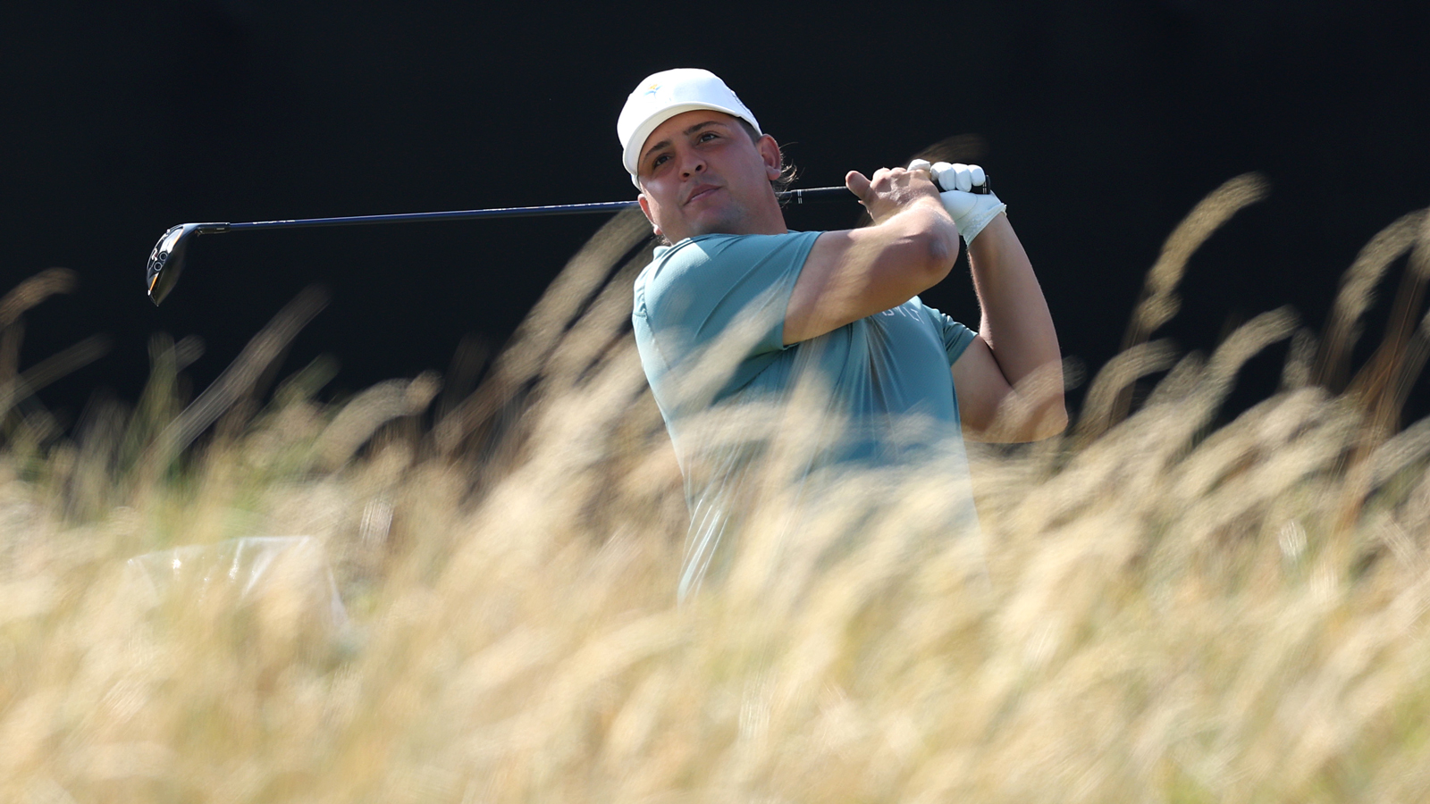 Mateo Pulcini hits a tee shot and watches its flight