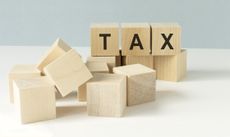 the word tax on a stack of wooden blocks