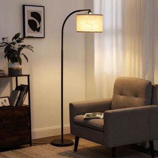 A floor lamp in a neutral living room