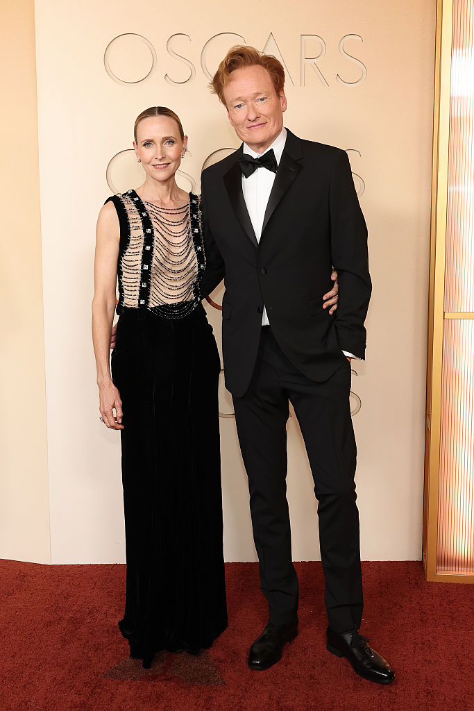 HOLLYWOOD, CALIFORNIA - MARCH 15: (L-R) Liza Powel O'Brien and Conan O'Brien attend the 98th Oscars at Dolby Theatre on March 15, 2026 in Hollywood, California. (Photo by Mike Coppola/Getty Images)