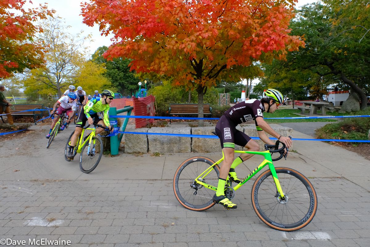 Jeremy Durrin (Neon Velo) leading a group onto the pavement during the starting loop