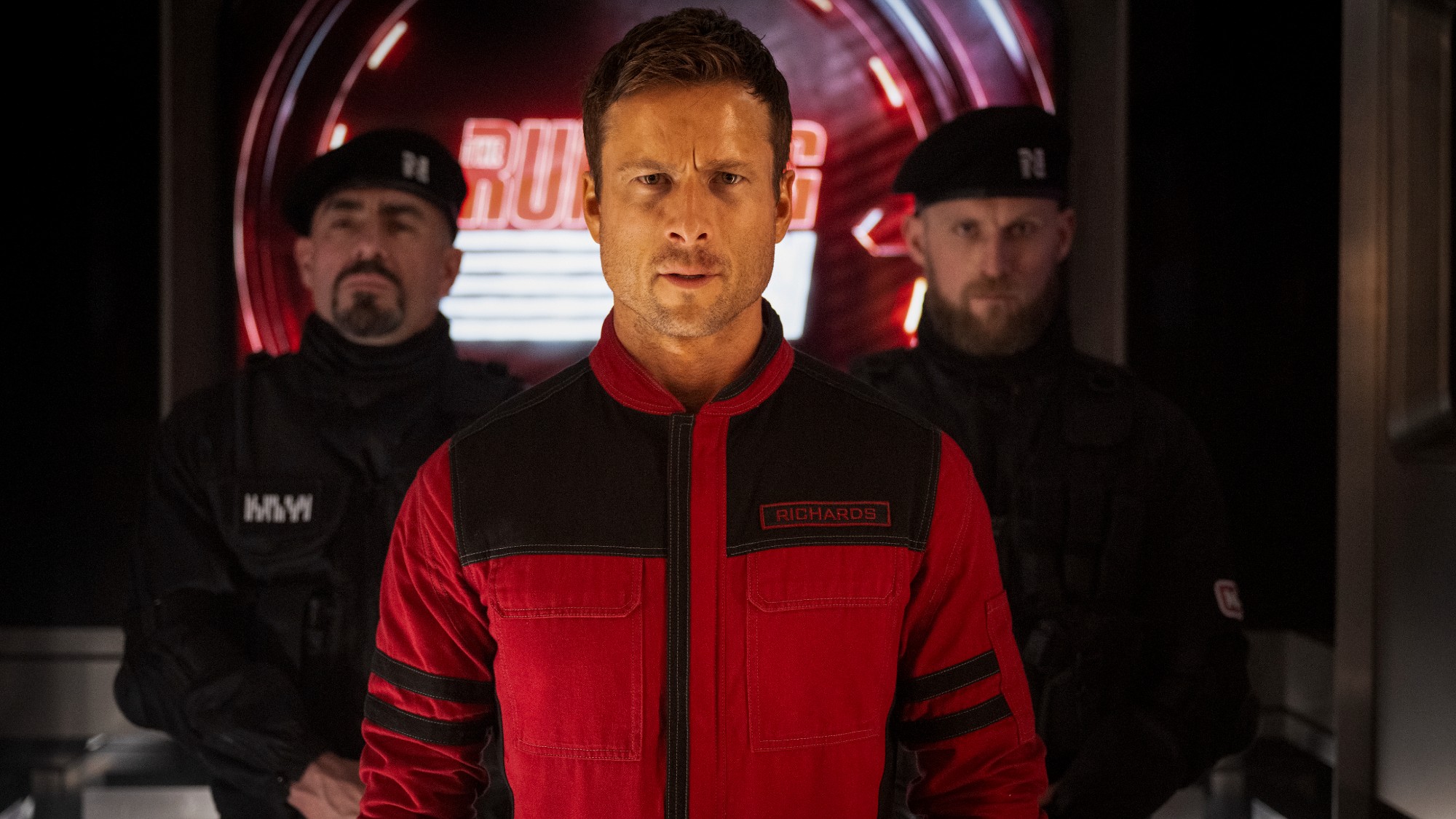 Glenn Powell in The Running Man looking straight ahead. 