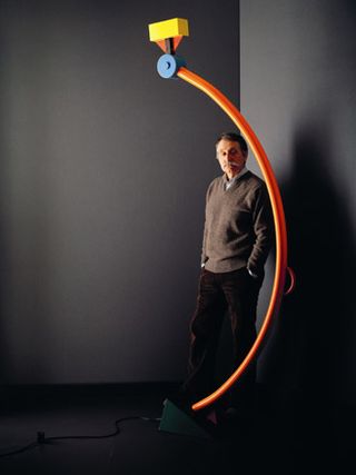 Ettore Sottsass with his floor lamp