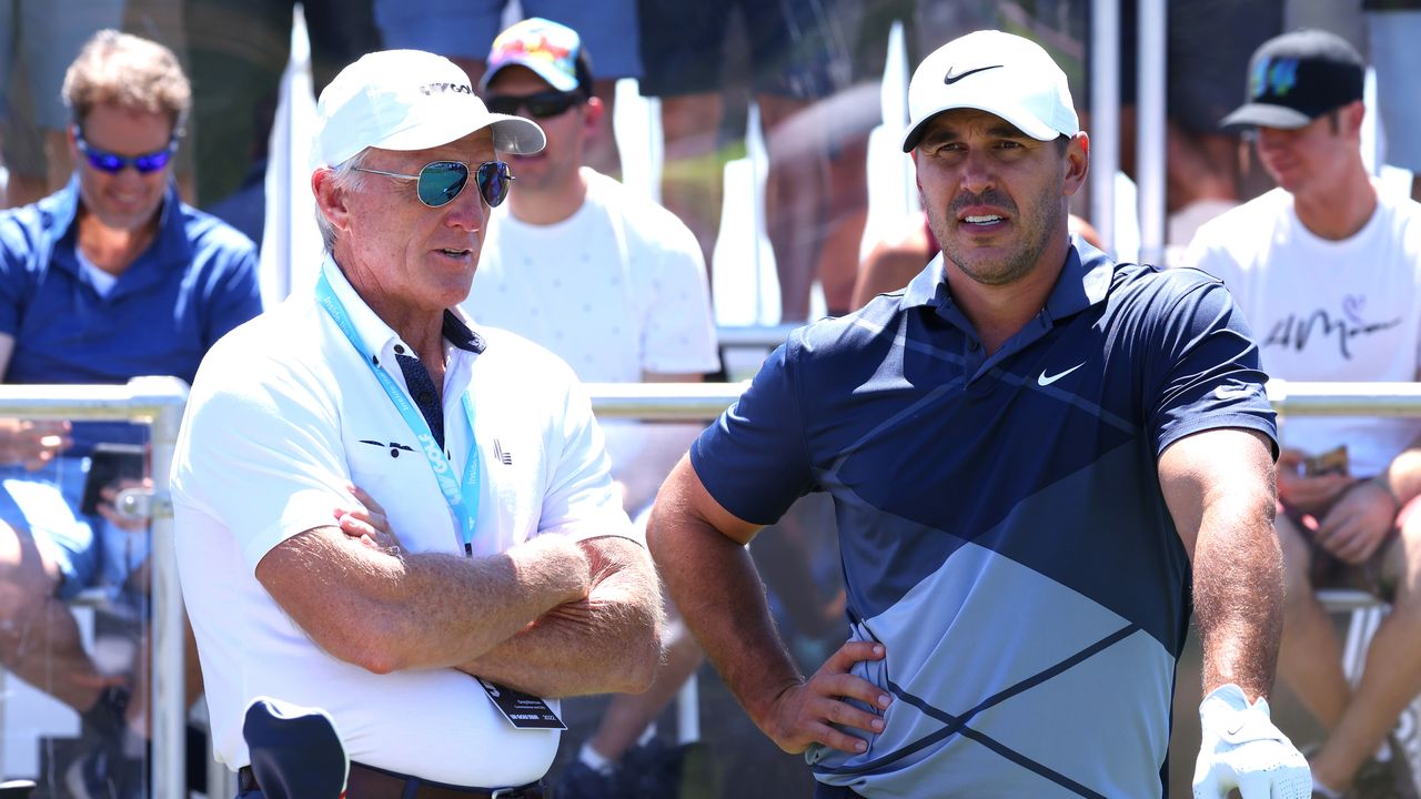 Greg Norman and Brooks Koepka chat on the 1st tee at a LIV Golf event