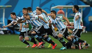 Argentina players celebrate their win on penalties against the Netherlands in the semi-finals of the 2014 World Cup.