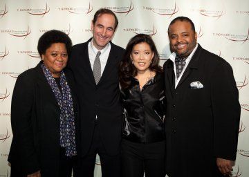 91967-Roland_Martin_CNN_Contributor_and_guest_EMCEE_joins_Diversity_Awards_honorees_Charisse_Lillie_VP_of_Community_Investment_EVP_of_360x256.jpg