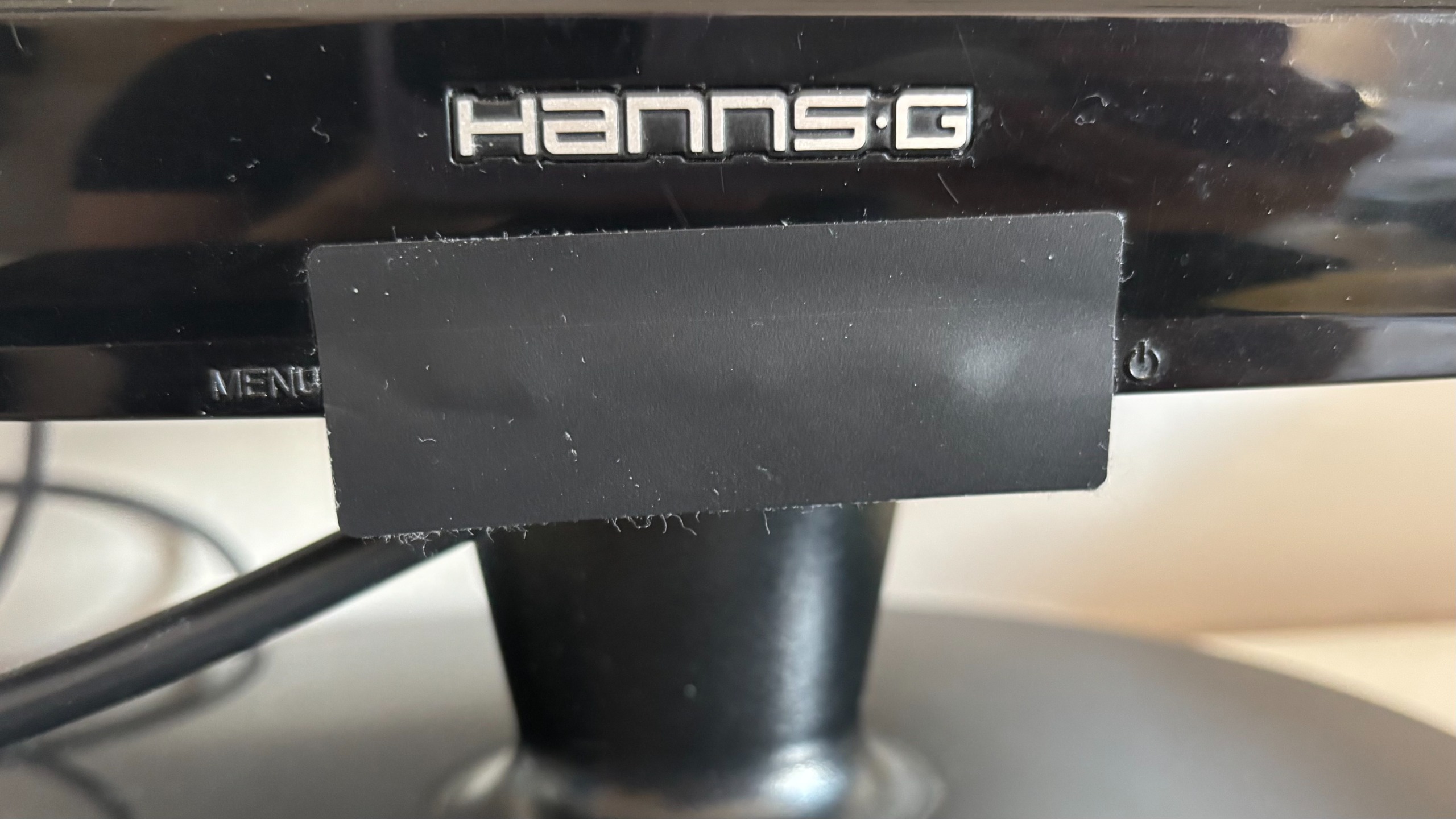 Light-blocking sticker on computer monitor's standby light.
