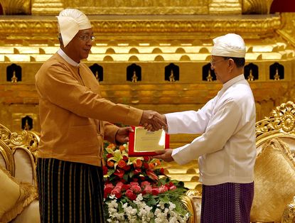 Myanmar's outgoing president, Thein Sein, hands over power to new President Htin Kyaw